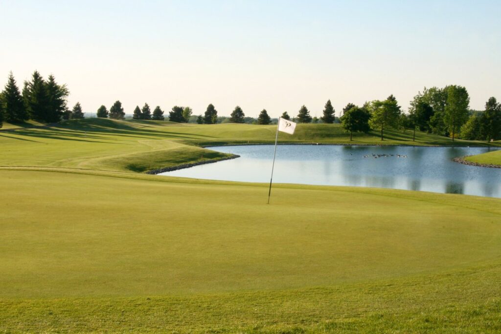 golf club, flagpole, lake, trees, grasses, lawn, soil